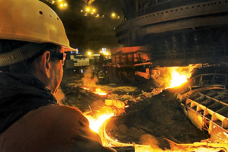 An employer of ArcelorMittal steel company works on Oct. 13 in Kryvyi Rih.